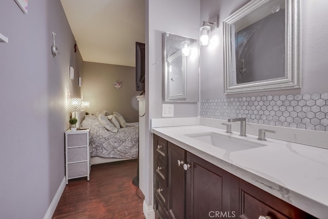 bathroom with vanity and hardwood / wood-style floors