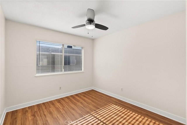 spare room featuring ceiling fan and hardwood / wood-style floors