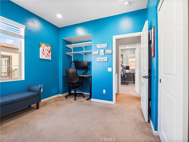 carpeted office with a wealth of natural light