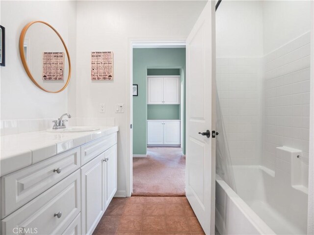 bathroom with vanity, tile patterned flooring, and bathing tub / shower combination