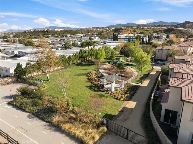 birds eye view of property featuring a mountain view