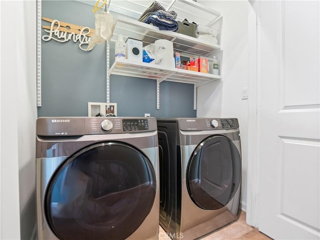 laundry room with separate washer and dryer