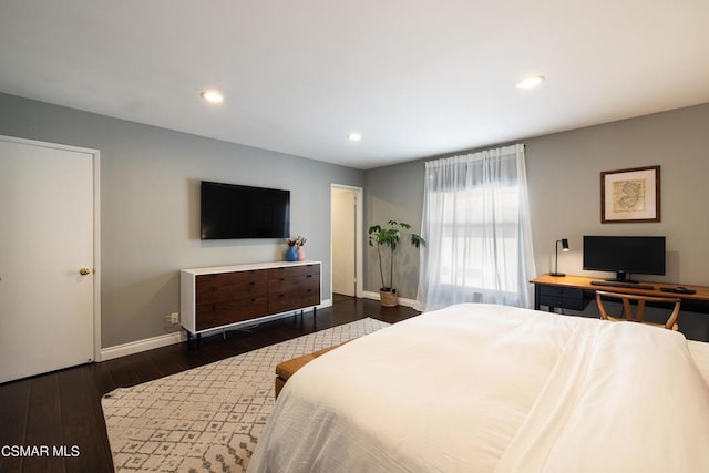 bedroom with dark hardwood / wood-style flooring