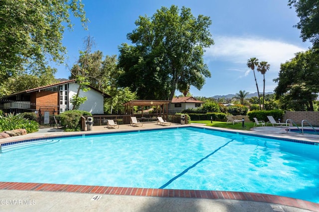 view of swimming pool featuring a patio area