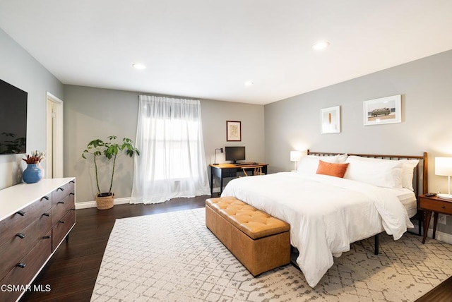 bedroom with dark wood-type flooring