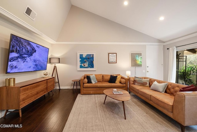 living room featuring lofted ceiling, crown molding, and hardwood / wood-style floors