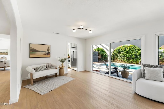 living area with light hardwood / wood-style floors