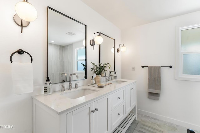 bathroom with vanity and tile patterned flooring