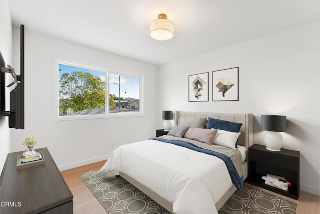 bedroom with hardwood / wood-style flooring