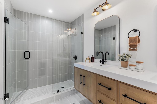 bathroom featuring tile patterned floors, vanity, and an enclosed shower