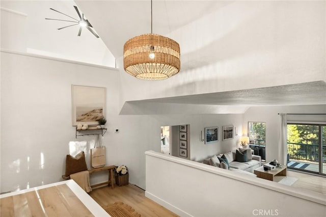 interior space with lofted ceiling and wood-type flooring