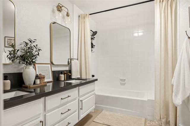 bathroom with vanity and shower / tub combo with curtain