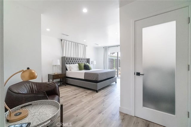 bedroom with light wood-type flooring