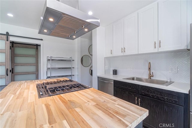 kitchen featuring white cabinets, appliances with stainless steel finishes, sink, and exhaust hood