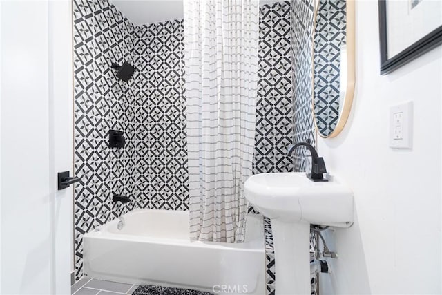 bathroom with tile patterned flooring and shower / bath combo with shower curtain