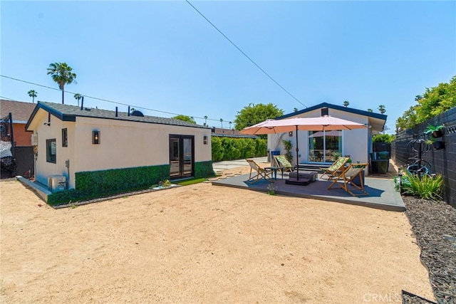 rear view of house featuring a patio