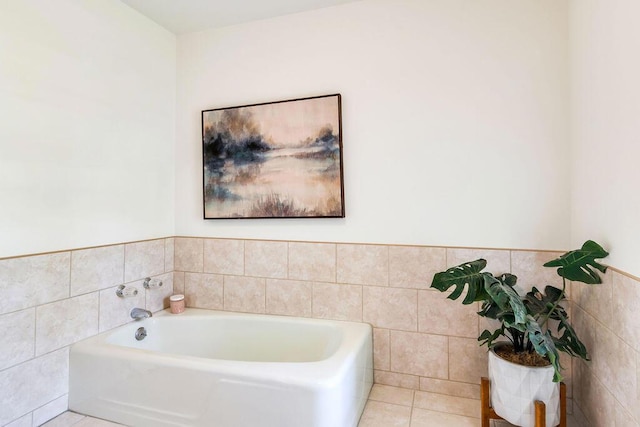 bathroom featuring tile patterned flooring and a washtub