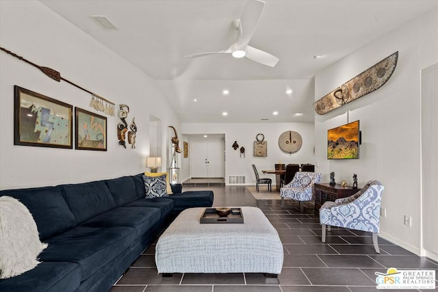 tiled living room featuring ceiling fan and lofted ceiling