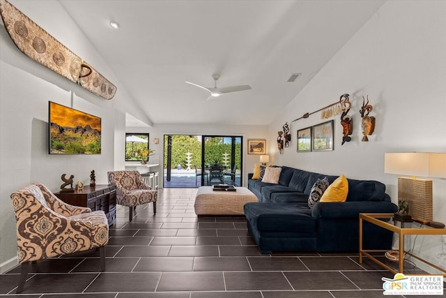 living room with dark tile patterned flooring, high vaulted ceiling, and ceiling fan