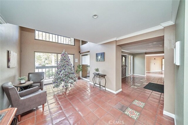 living room featuring tile patterned flooring and ornamental molding