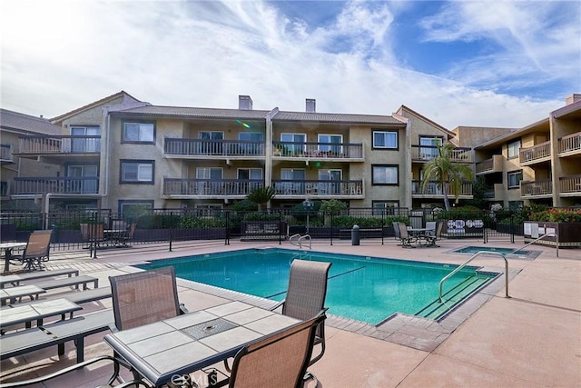 view of swimming pool with a patio