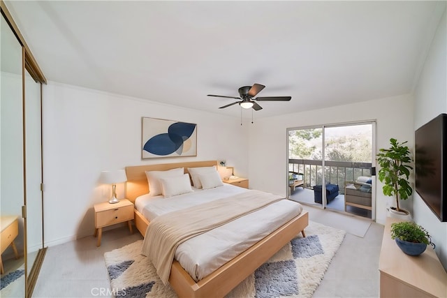 bedroom featuring access to exterior, a closet, and ceiling fan