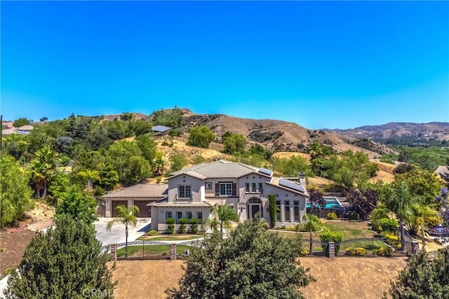 birds eye view of property featuring a mountain view