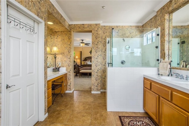 bathroom featuring vanity, ceiling fan, crown molding, and walk in shower