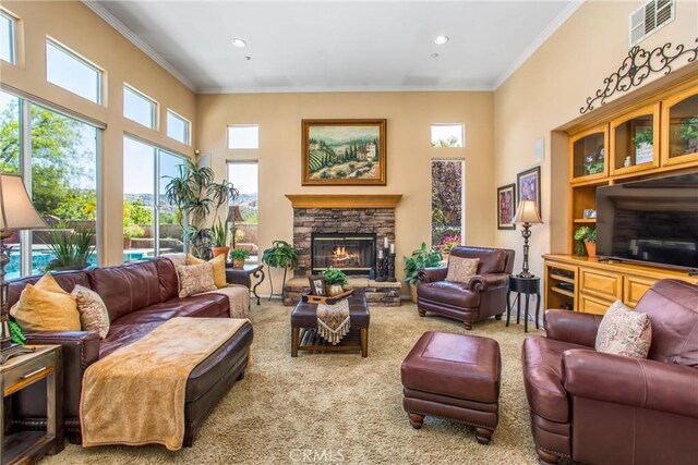 living room with a fireplace, crown molding, and carpet flooring