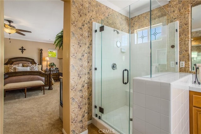 bathroom with ceiling fan, walk in shower, ornamental molding, and vanity