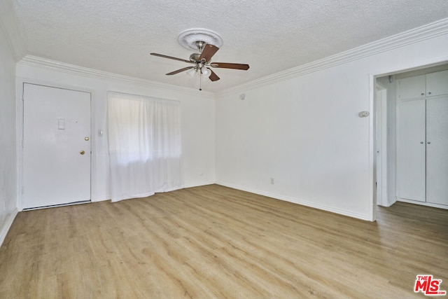 interior space with ceiling fan, light wood-type flooring, crown molding, and a textured ceiling