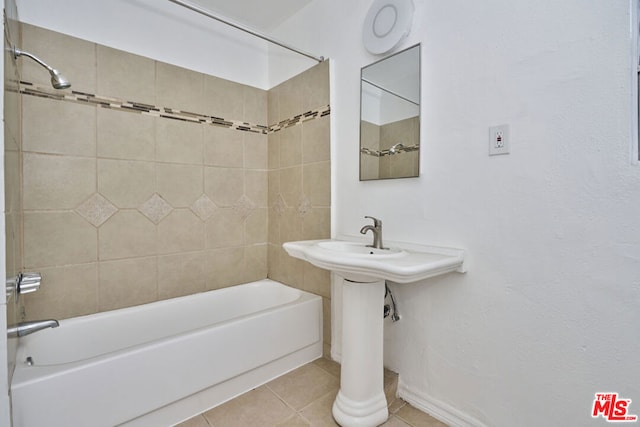 bathroom with tile patterned floors and tiled shower / bath combo