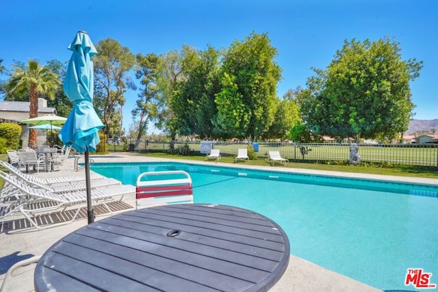 view of pool featuring a patio area