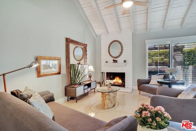 tiled living room with ceiling fan, a brick fireplace, beam ceiling, high vaulted ceiling, and wooden ceiling