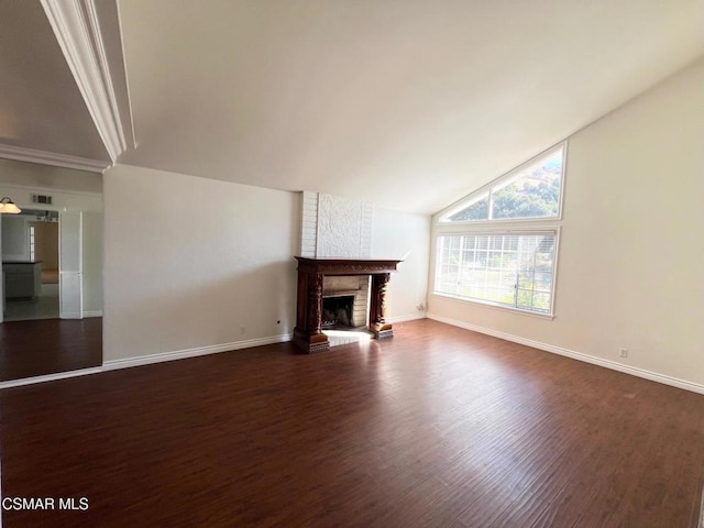 unfurnished living room with dark hardwood / wood-style flooring, lofted ceiling, and a fireplace