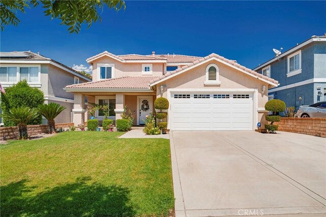 view of front of home with a garage and a front yard