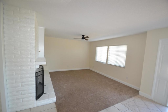 unfurnished living room with ceiling fan and light tile patterned floors