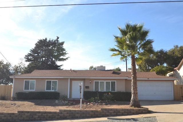 ranch-style home featuring a garage