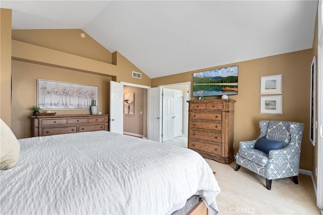 carpeted bedroom featuring vaulted ceiling