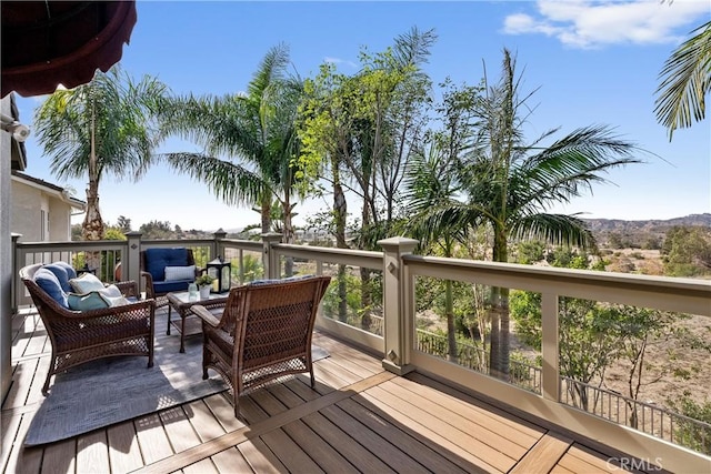 wooden deck featuring an outdoor living space