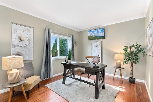 office space featuring hardwood / wood-style flooring and crown molding