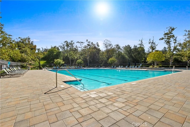 view of swimming pool with a patio