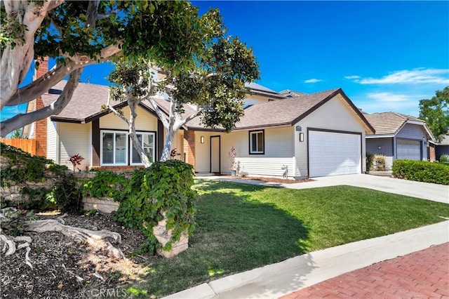 view of front of home featuring a garage and a front lawn