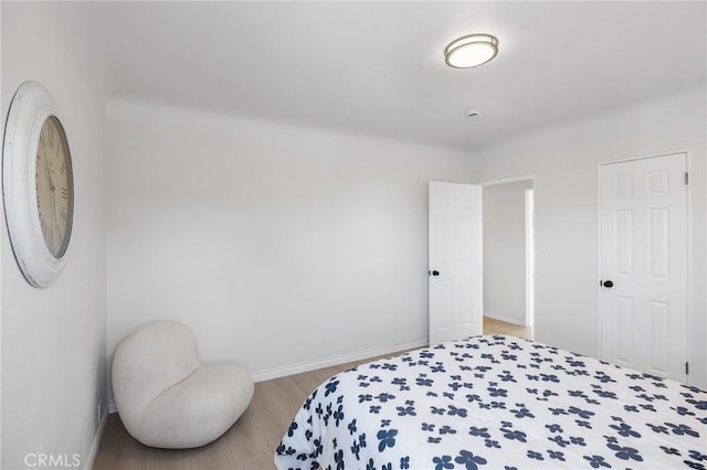 bedroom with light hardwood / wood-style floors