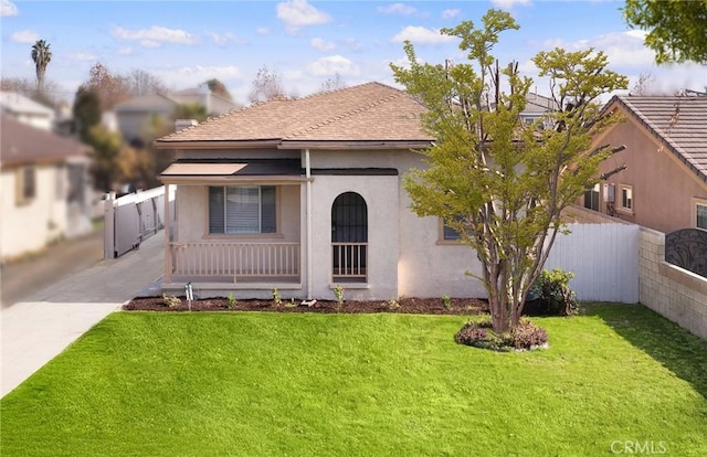 view of front of home featuring a front yard and a porch