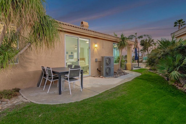 patio terrace at dusk with a yard