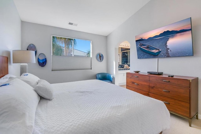 bedroom with light colored carpet