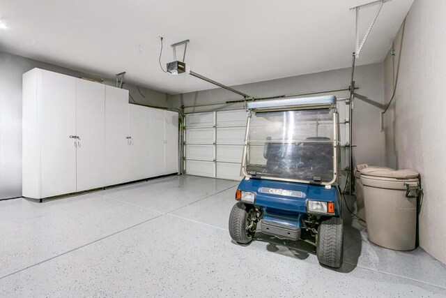 garage featuring a garage door opener