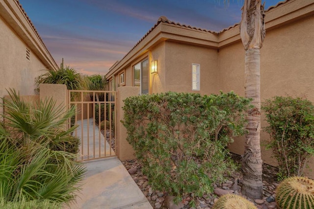 view of property exterior at dusk