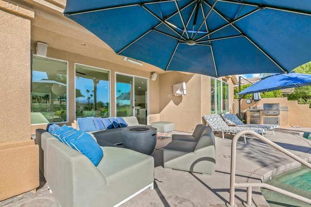 view of patio featuring exterior kitchen, outdoor lounge area, and area for grilling